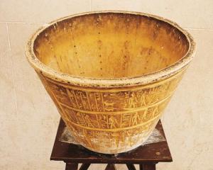Egyptian water-clock. Copy of a conical alabaster vase with columns of 12 holes. Astronomical signs decoration on the outer surface. Image courtesy of Getty Images DEA Picture Library, http://www.qdl.qa/en/robots-musicians-and-monsters-world%E2%80%99s-most